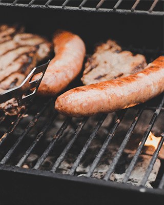 Sausages on a natural gas grill